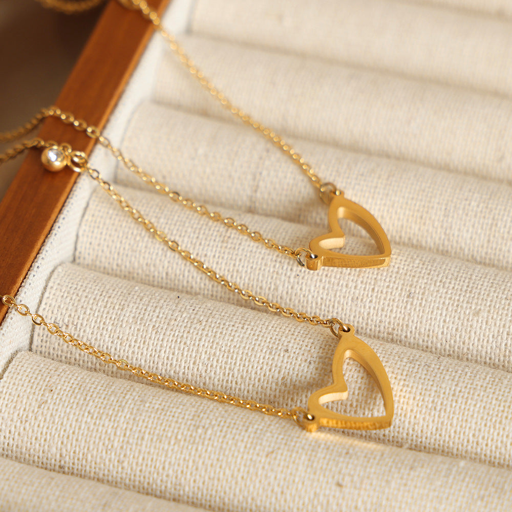 Wholesale Valentine's Day Titanium Steel 18k Gold Asymmetric Hollow Heart Pendant Necklace